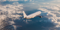 Plane flying, blue sky with clouds